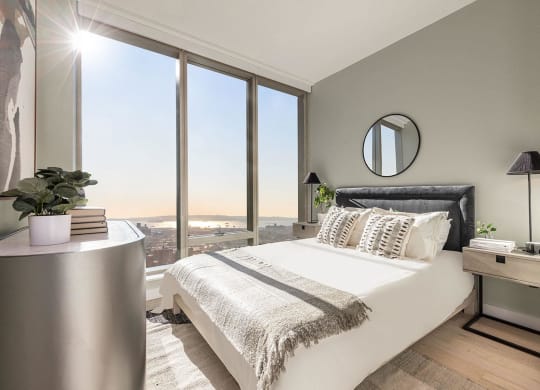a bedroom with a large window and a bed at The Paxton, Brooklyn, NY 11201