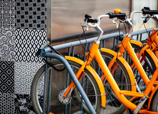 a row of bikes parked next to a window at The Paxton, Brooklyn