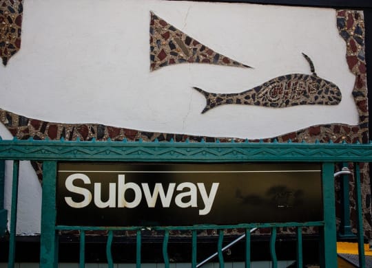 a sign for a subway store with fish on it at The Paxton, Brooklyn