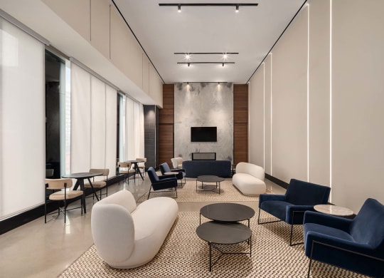 a lobby with couches and chairs and tables at The Paxton, Brooklyn, NY 11201