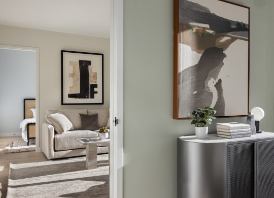 a living room with a couch and a table and a radiator at The Paxton, Brooklyn, New York