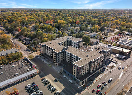 A large building with a parking lot in front of it.
