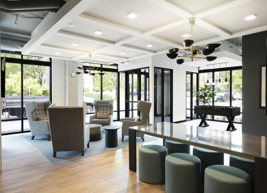 a conference room with a table and chairs and a piano