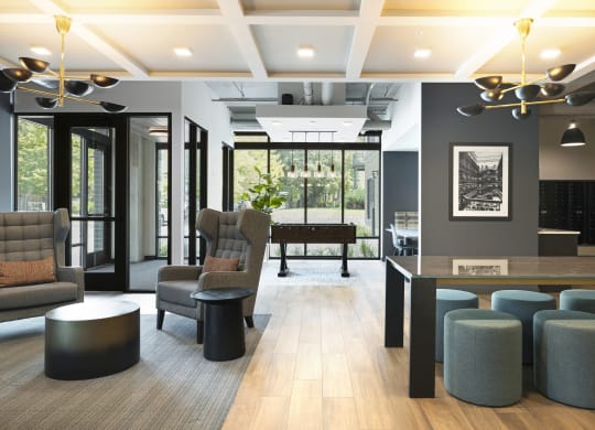 a lobby with chairs and a bar and a piano