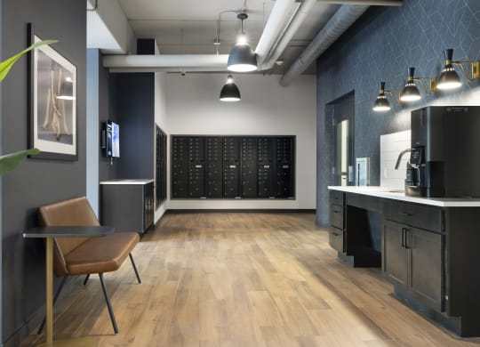 a room with a desk and a chair and a wall with a calendar