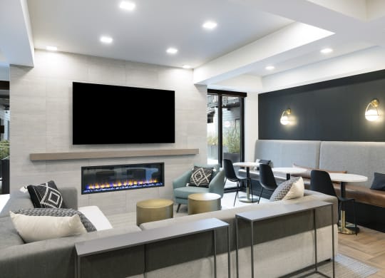 a living room with a fireplace and a large screen tv