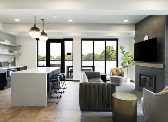 a living room with a fireplace and a table with chairs