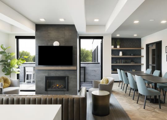 a living room with a fireplace and a table and chairs