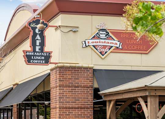 A cafe with a sign that says Louisiana on it.