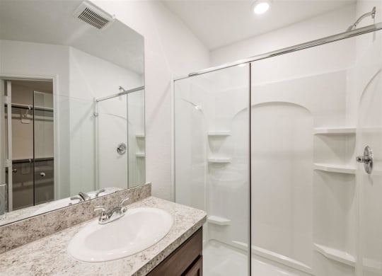 a bathroom with a sink and a shower at The Village at Granger Pines, Conroe