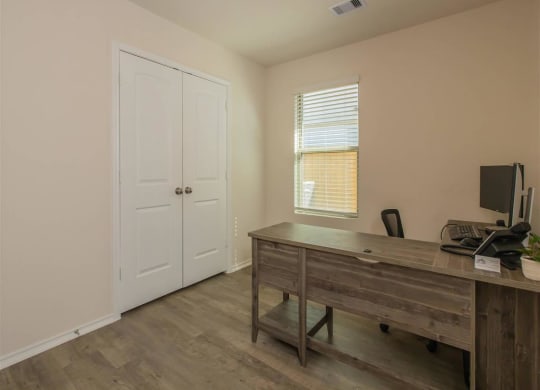 an office with a desk and a window at The Village at Granger Pines, Conroe, 77302