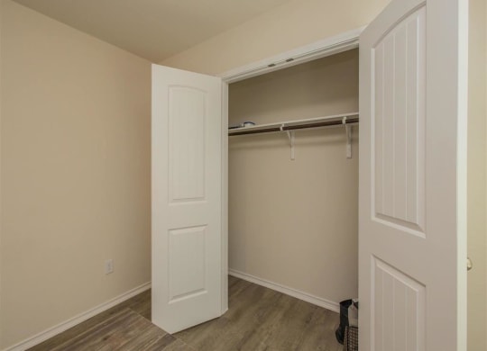 our apartments offer a bedroom with a king sized bed  at The Village at Granger Pines, Conroe, TX 77302