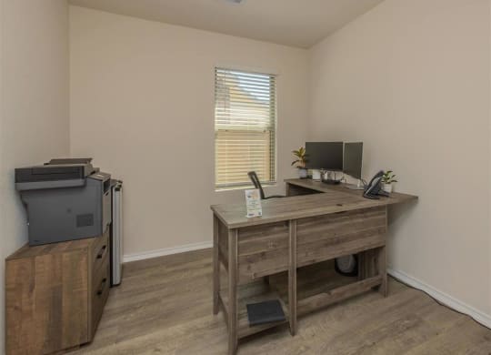 an office with a desk and a printer at The Village at Granger Pines, Conroe, TX 77302