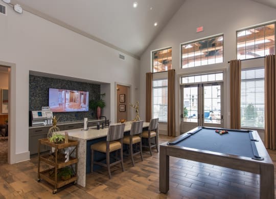 take a break in the resident clubhouse with a pool table and flat screen tv at The Whitworth, Williamsburg, 23185