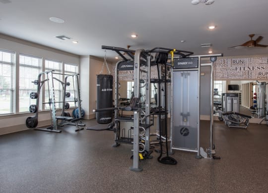 a fitness room with a lot of exercise equipment at The Whitworth, Williamsburg, 23185