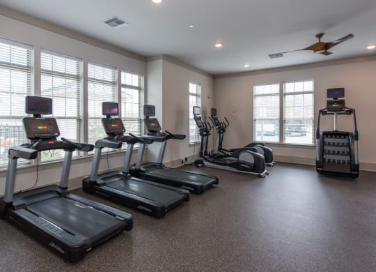 an exercise room with treadmills and ellipticals at The Whitworth, Williamsburg, 23185