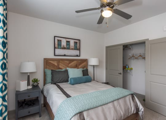 a bedroom with a bed and a ceiling fan at The Whitworth, Williamsburg, 23185