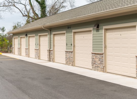 a row of garage doors in a row at The Whitworth, Virginia, 23185