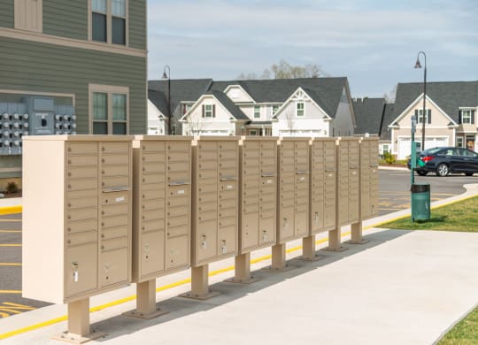 a row of mailboxes on a sidewalk in front of a house at The Whitworth, Virginia