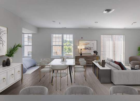 a living room and dining room with a couch and a table