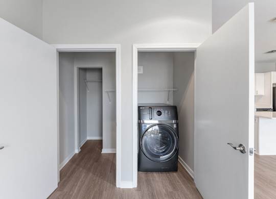 a washer and dryer in a small room in a house
