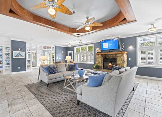 a living room with couches and a fireplace