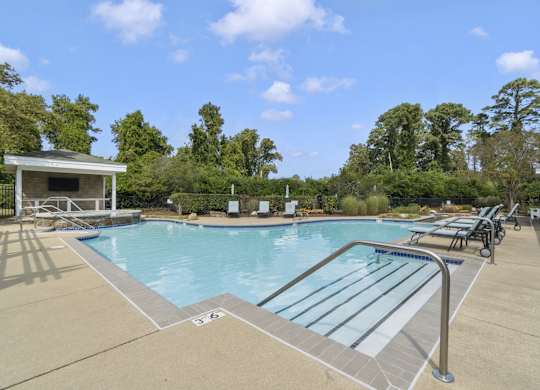 the swimming pool at the preserve at polo towers apartments