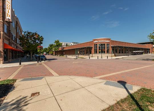 a large brick building on the corner of a street