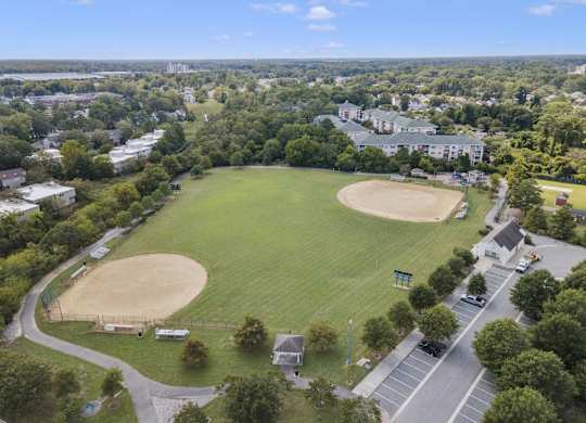 an aerial view of a baseball field in a city park