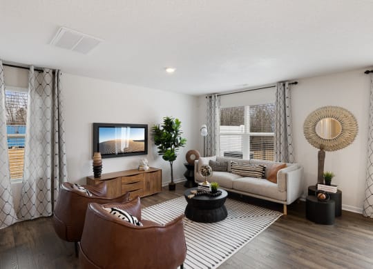 a living room with a couch and a tv at Summit Place Apartments, Oak Ridge, Tennessee