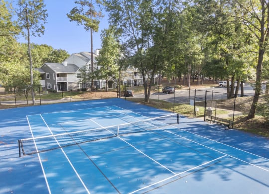 the tennis courts at the whispering winds apartments in pearland at Trails at Short Pump Apartments, Richmond, 23233