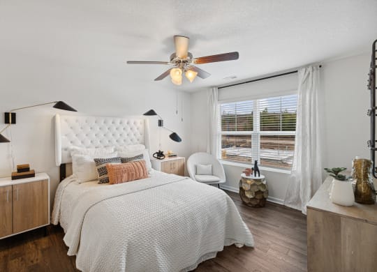 a bedroom with a bed and a ceiling fan at Summit Place Apartments, Tennessee