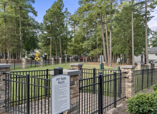 a cemetery with a fence and a sign in front of it at Trails at Short Pump Apartments, Richmond, VA, 23233