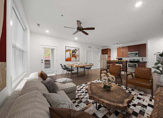 A living room with a brown couch and a coffee table at Skyloft in Asheville, 28803