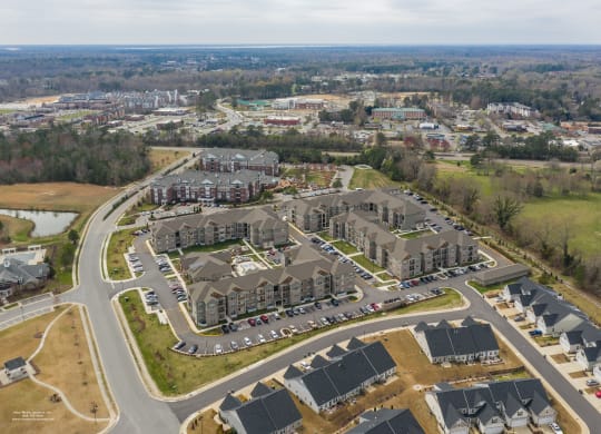an aerial view of a large complex of houses in a suburb at The Whitworth, Williamsburg, 23185