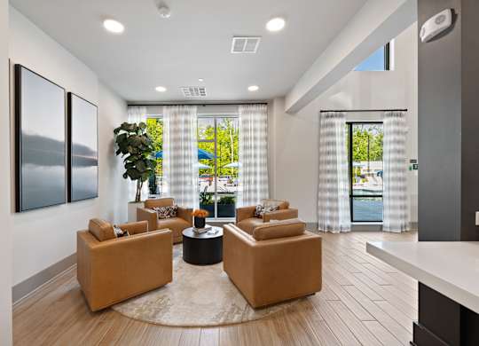 A living room with a large window and a view of the outside.