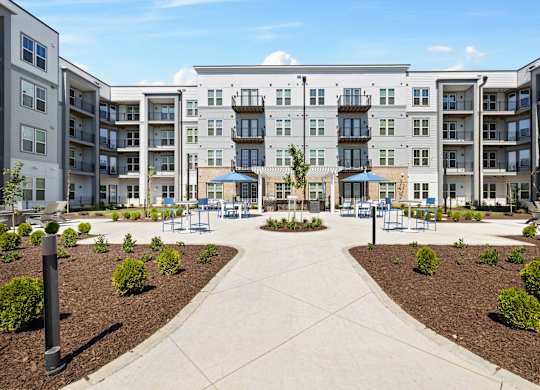 A large apartment complex with a courtyard in the middle.