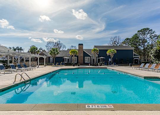 A large swimming pool with a depth marker reading 6 feet.