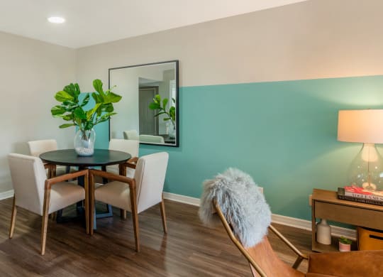 a dining room with a table and chairs and a mirror at The Villas at Ibis Landing, Parkland, 33067