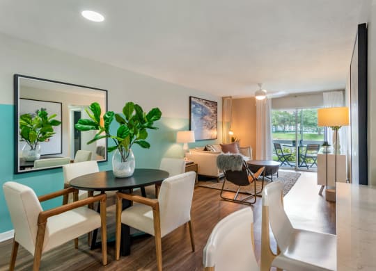 a living room and dining room with a table and chairs at The Villas at Ibis Landing, Florida, 33067