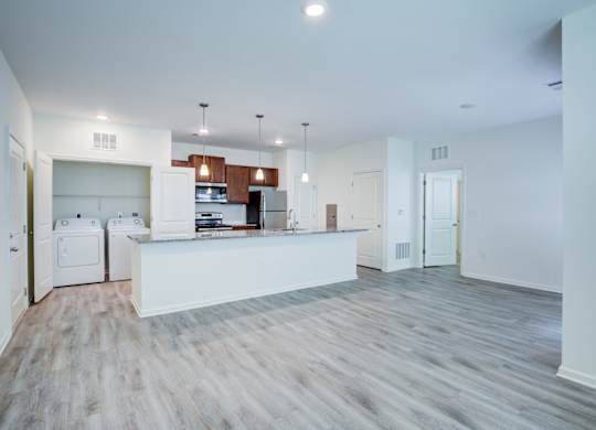 A kitchen with white appliances and a white countertop.