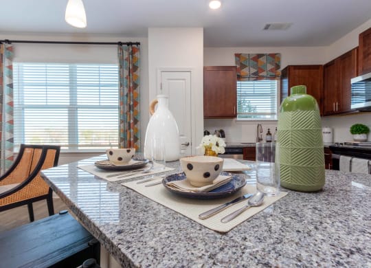 a kitchen with a granite counter top and a table