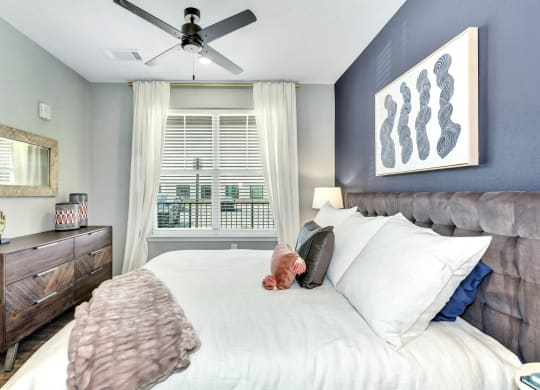Bedroom with cozy bed at Farmhaus Apartments, Madison