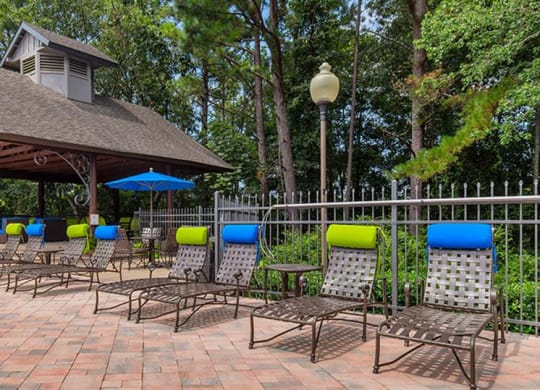 a picnic area with chairs and a gazebo at High Ridge Apartments, Athens