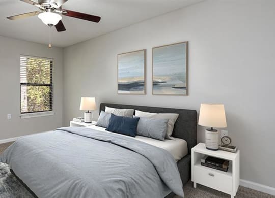 a bedroom with a bed and a ceiling fan at High Ridge Apartments, Athens Georgia