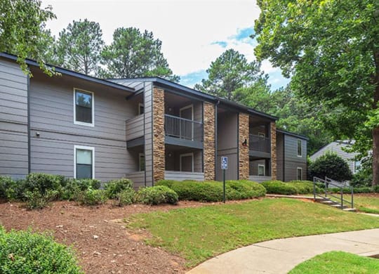 a gray house with a sidewalk in front of it at High Ridge Apartments, Athens, 30606