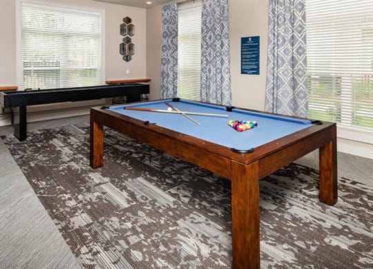 a pool table in a living room with windows at Promenade at Newnan Crossing, Georgia, 30265