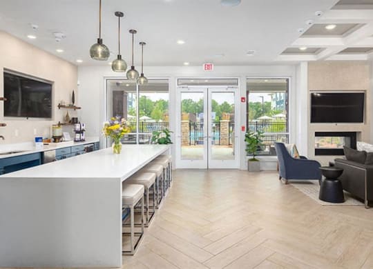 a kitchen and living room with a white counter top at Promenade at Newnan Crossing, Georgia