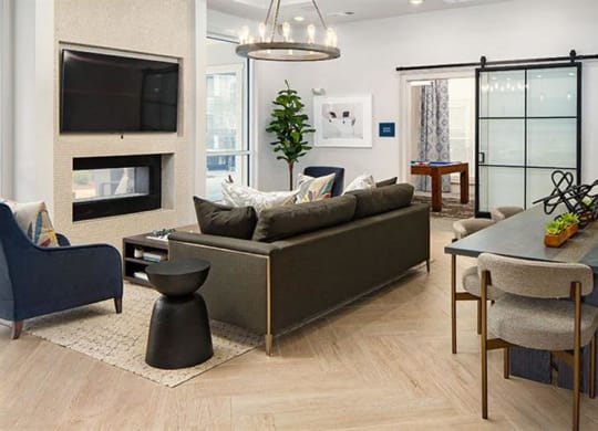 a living room with a couch and a table at Promenade at Newnan Crossing, Georgia, 30265