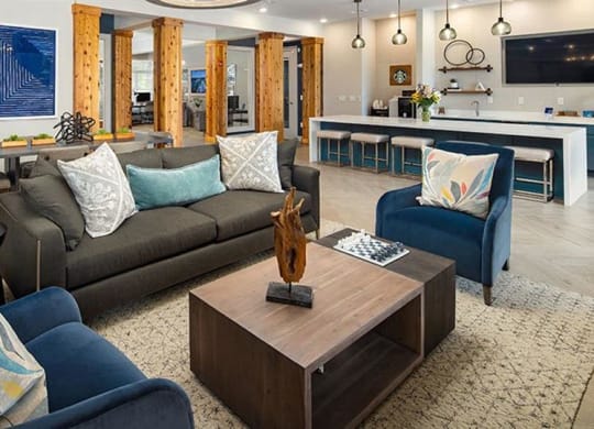 a living room with a couch and a coffee table at Promenade at Newnan Crossing, Newnan